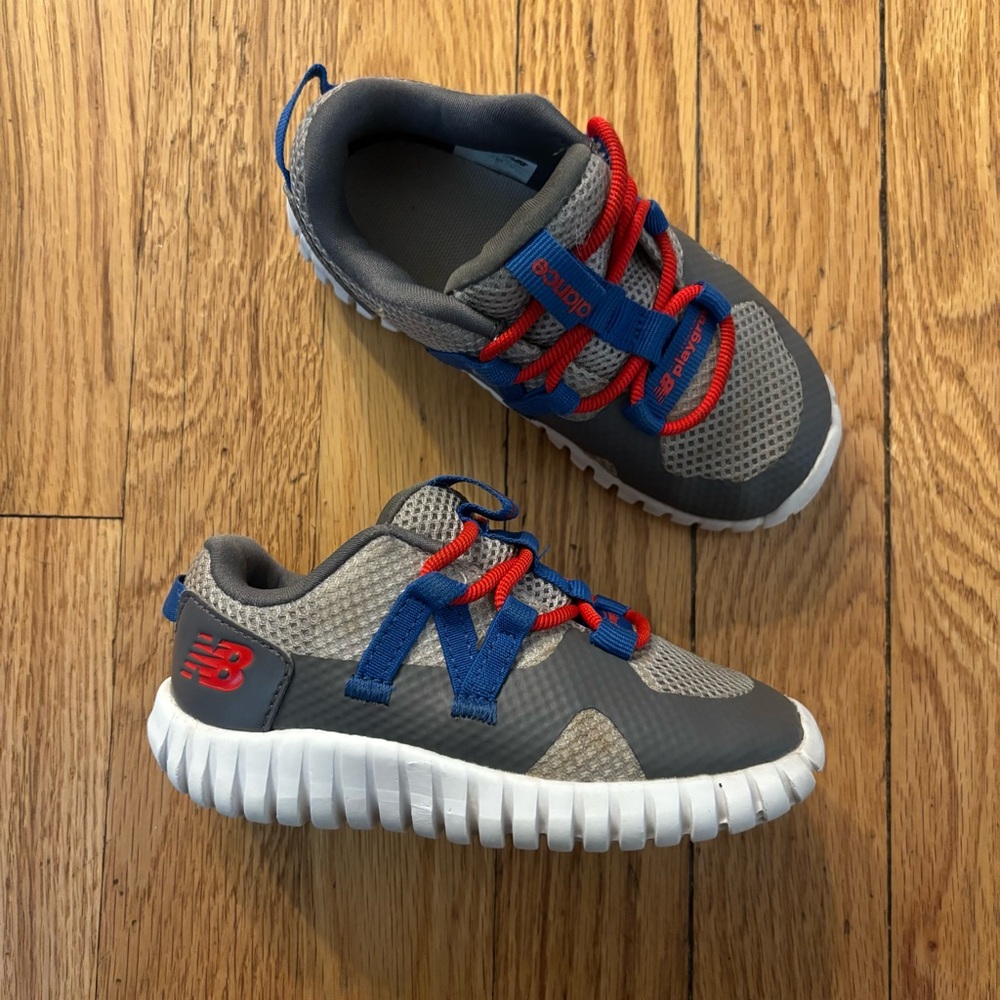 New Balance Kids' Bungee Gray Sneakers with Blue and Red Accents